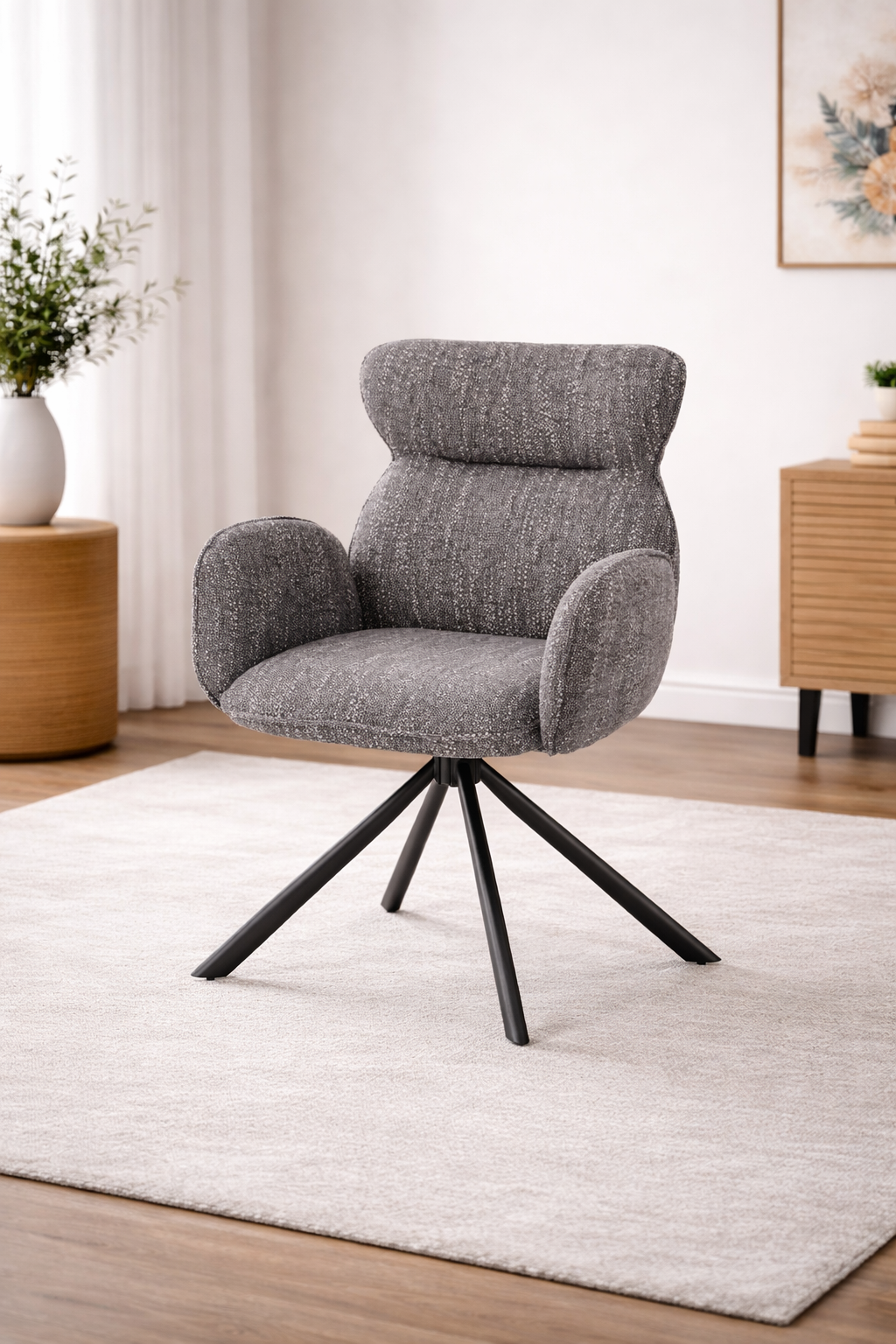 Krzesło PUCHATEK – eleganckie, obrotowe krzesło tapicerowane w popielatym odcieniu na stelażu w czerni.